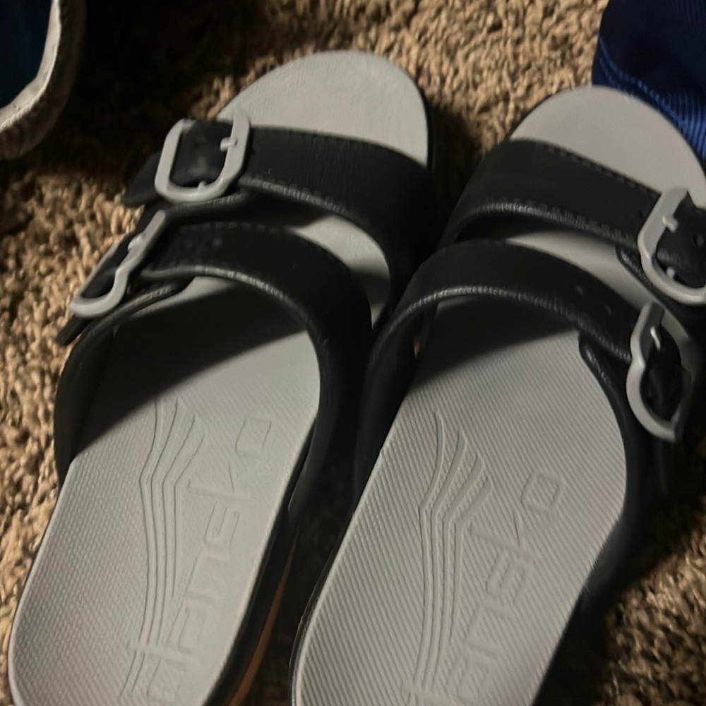 White and pink Dansko sandals in excellent condition selling for 45
